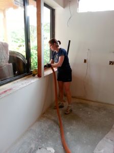 Kathy vacuum's up drywall dust. What a mess that was! Thankfully Kathy is a pro with a vacuum (it is the one power tool - aside from the washer/dryer - that I still can't figure out!).